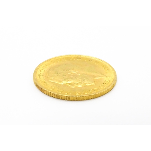 962 - Coin : A 1913 gold half sovereign coin. Total weight approx. 4g