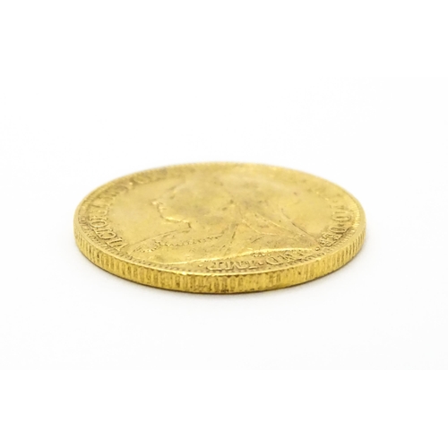 964 - Coin: A Victorian 1893 gold sovereign coin. Approx. 8g