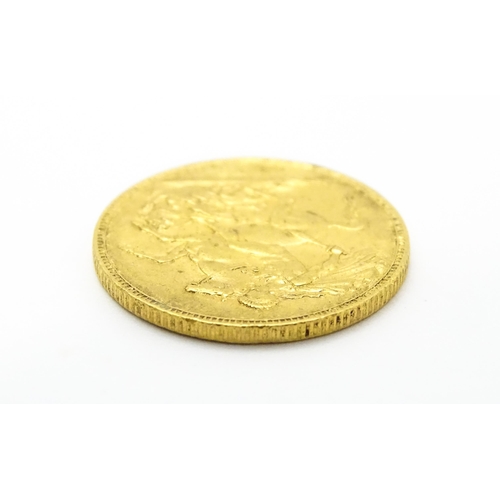 964 - Coin: A Victorian 1893 gold sovereign coin. Approx. 8g