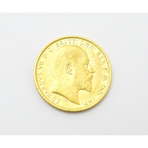 965 - Coin: An Edward VII 1903 gold sovereign coin. Approx. 8g