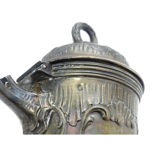 539 - A French silver coffee pot with acanthus scroll decoration and laurel chaplet formed finial. Approx.... 