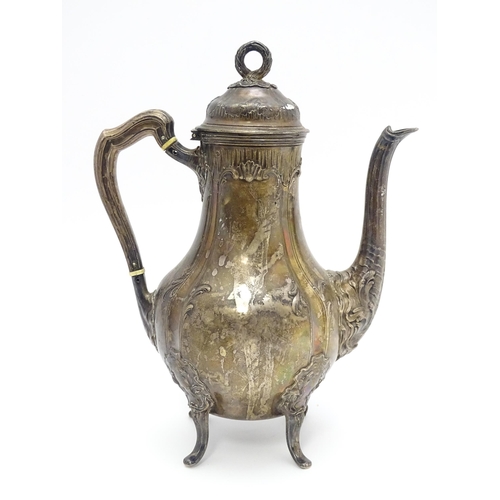 539 - A French silver coffee pot with acanthus scroll decoration and laurel chaplet formed finial. Approx.... 