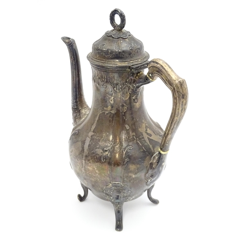 539 - A French silver coffee pot with acanthus scroll decoration and laurel chaplet formed finial. Approx.... 