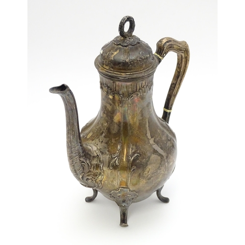 539 - A French silver coffee pot with acanthus scroll decoration and laurel chaplet formed finial. Approx.... 