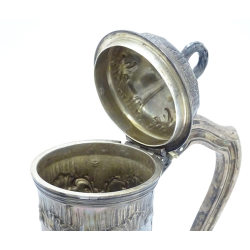 539 - A French silver coffee pot with acanthus scroll decoration and laurel chaplet formed finial. Approx.... 