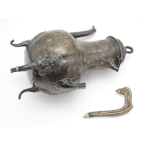 539 - A French silver coffee pot with acanthus scroll decoration and laurel chaplet formed finial. Approx.... 