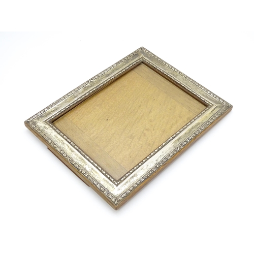 665 - An easel back photograph frame with silver surround hallmarked Birmingham 1910 , maker Henry William... 