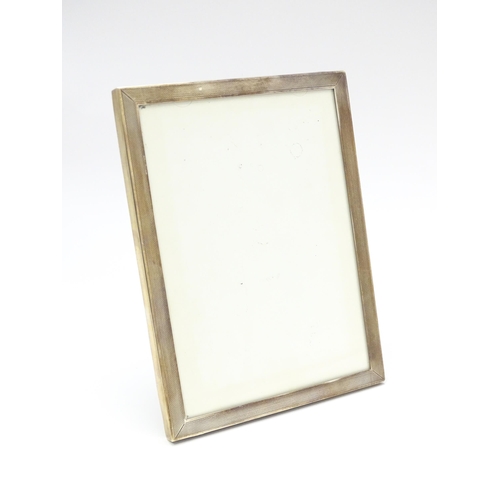 665A - An easel back photograph frame with silver surround hallmarked Birmingham 1962, maker Sanders & Mack... 