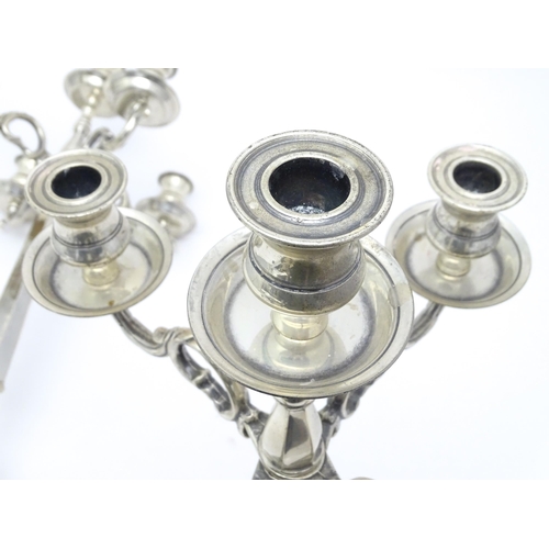 667 - A pair of silver plate five branch candelabra / candelabrum. Approx. 23