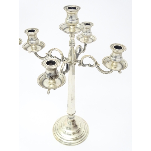 667 - A pair of silver plate five branch candelabra / candelabrum. Approx. 23