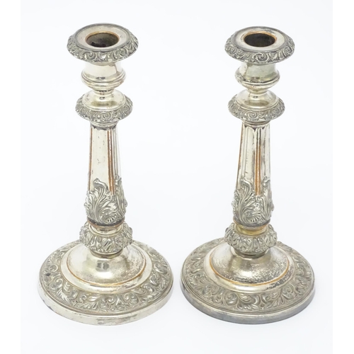 674 - A pair of Sheffield plate candlesticks. Approx. 9