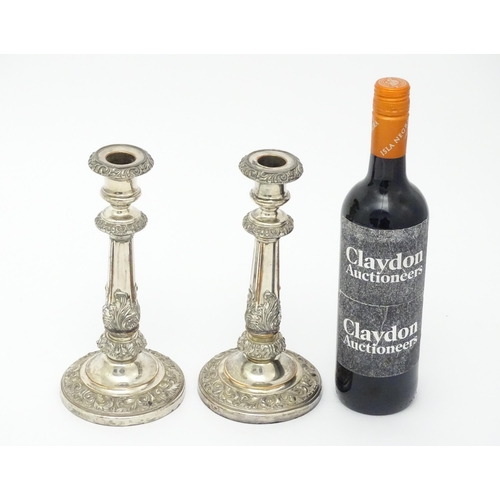 674 - A pair of Sheffield plate candlesticks. Approx. 9