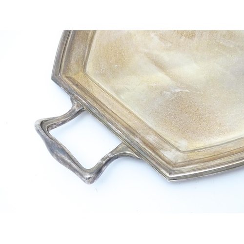 679 - An Art Deco silver plate tray with twin handles. Approx. 24