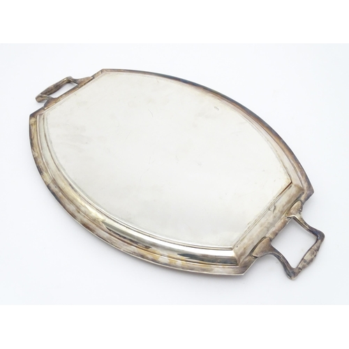 679 - An Art Deco silver plate tray with twin handles. Approx. 24