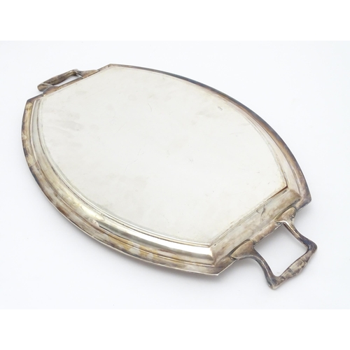 679 - An Art Deco silver plate tray with twin handles. Approx. 24