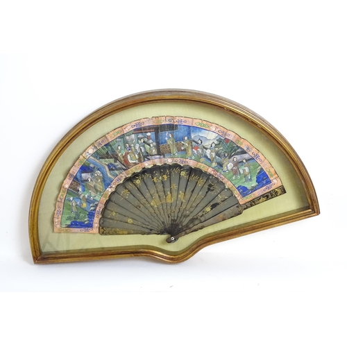 1099 - An early 20thC Chinese fan with hand painted paper scene depicting figures with offerings, the 20 la... 