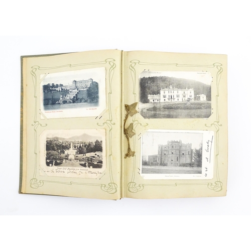 2139 - A 20thC postcard album to include various Royal residences, country houses and palaces to include Wi... 