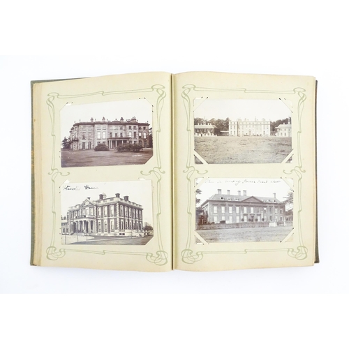 2139 - A 20thC postcard album to include various Royal residences, country houses and palaces to include Wi... 