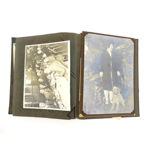 2141 - An early 20thC photograph and postcard album containing various South American scenes to include Esp... 