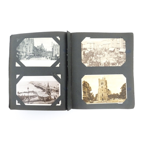 2142 - A 20thC postcard albums to include various topographical picture postcards to include Kenilworth, Ke... 