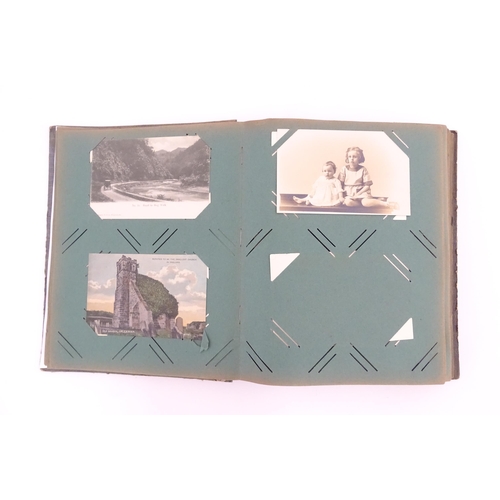 2144 - A late 19th / early 20thC postcard album containing various portraits, landscapes etc. to include Ro... 