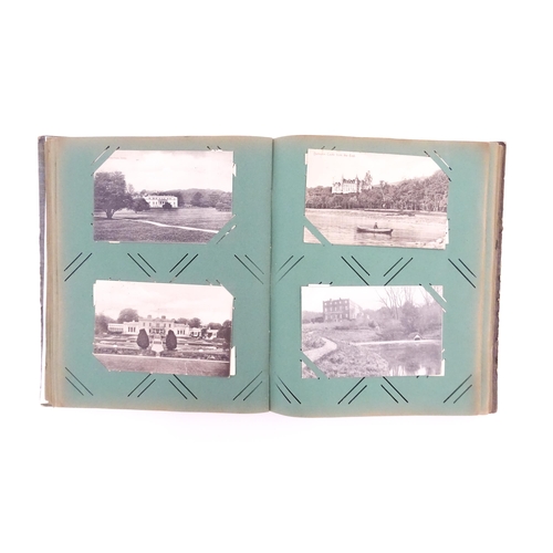 2144 - A late 19th / early 20thC postcard album containing various portraits, landscapes etc. to include Ro... 