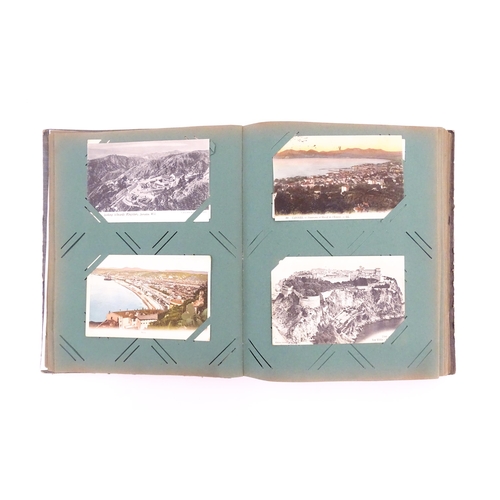 2144 - A late 19th / early 20thC postcard album containing various portraits, landscapes etc. to include Ro... 