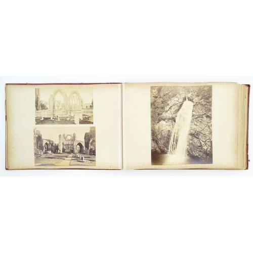 2146 - A Victorian photograph album containing various views to include Lincoln Cathedral, Dairy Bridge Rok... 