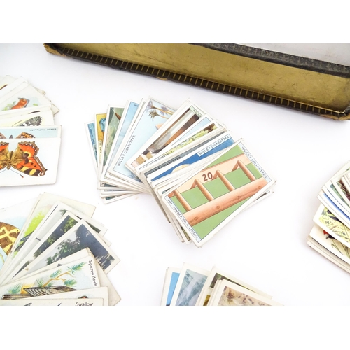 2155 - A large quantity of assorted 20thC cigarette and tea cards to include examples from Will's Cigarette... 