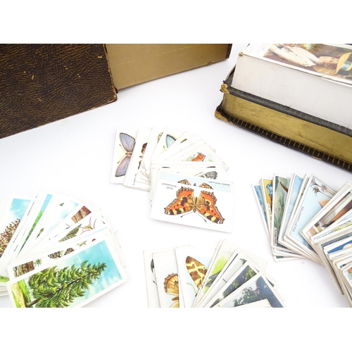 2155 - A large quantity of assorted 20thC cigarette and tea cards to include examples from Will's Cigarette... 