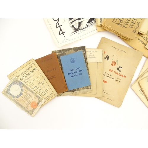 2159 - A quantity of World War II / Two military ephemera to include assorted 1940s newspapers pages to inc... 