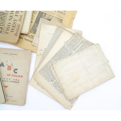 2159 - A quantity of World War II / Two military ephemera to include assorted 1940s newspapers pages to inc... 