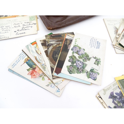 2161 - A quantity of assorted early 20thC postcards to include humorous examples, greetings cards, topograp... 