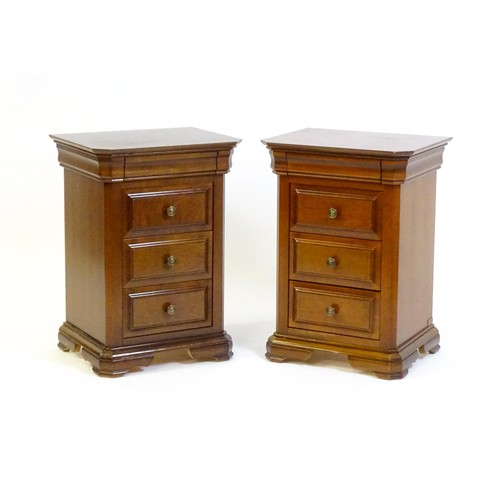 1584 - A pair of modern bedside cabinets with moulded tops, each chest having a cushion drawer above three ... 