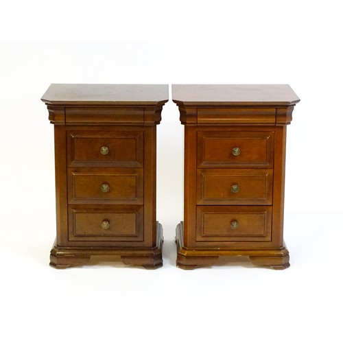 1584 - A pair of modern bedside cabinets with moulded tops, each chest having a cushion drawer above three ... 