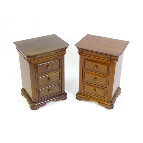 1584 - A pair of modern bedside cabinets with moulded tops, each chest having a cushion drawer above three ... 