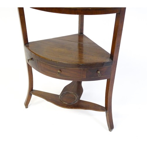 1612 - A late Georgian mahogany corner washstand with three tiers and three false drawers raised on splayed... 