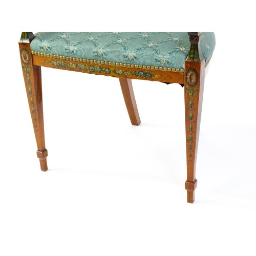 1538 - A late 19thC satinwood arm chair with a profusely decorated painted frame showing fruit, ivy and neo... 