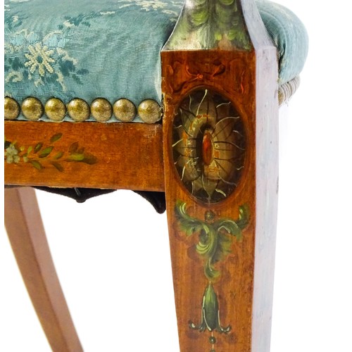 1538 - A late 19thC satinwood arm chair with a profusely decorated painted frame showing fruit, ivy and neo... 