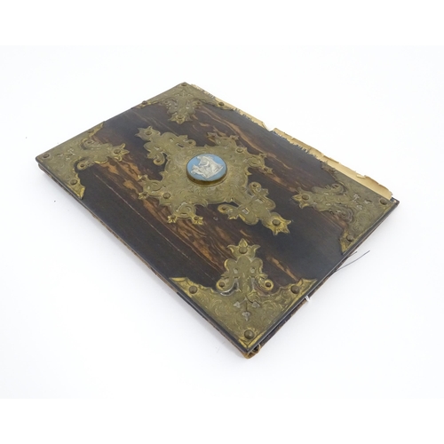 1208 - A Victorian blotter with coromandel front cover with decorative brass mounts and set with central Ja... 