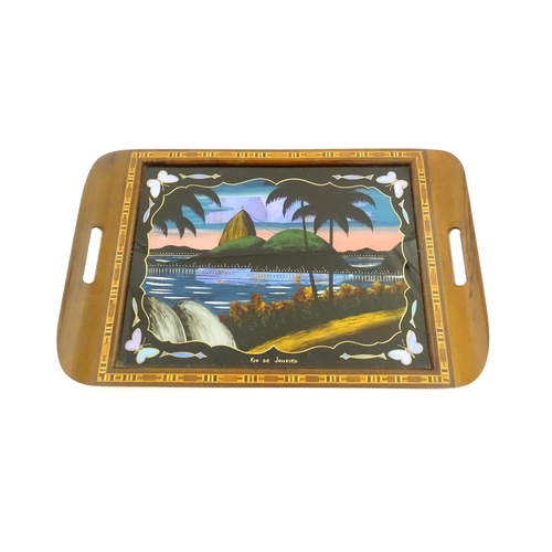 1270 - A 20thC Brazilian twin handled tray set with central scene depicting a Rio de Janeiro view with butt... 