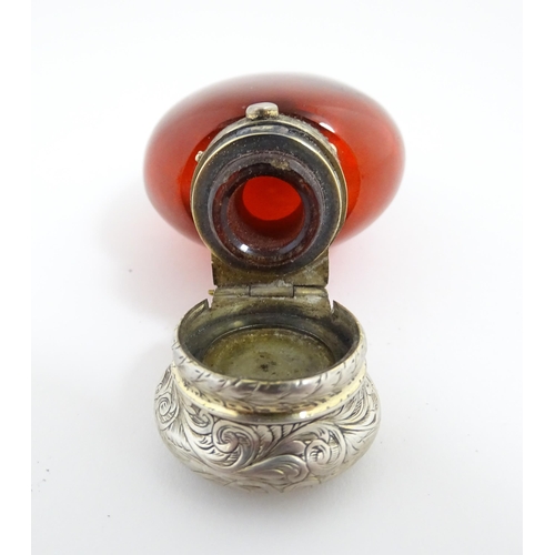 208 - A 19thC cranberry glass scent bottle / perfume flask with white metal top, maker GB. Approx. 3 1/2