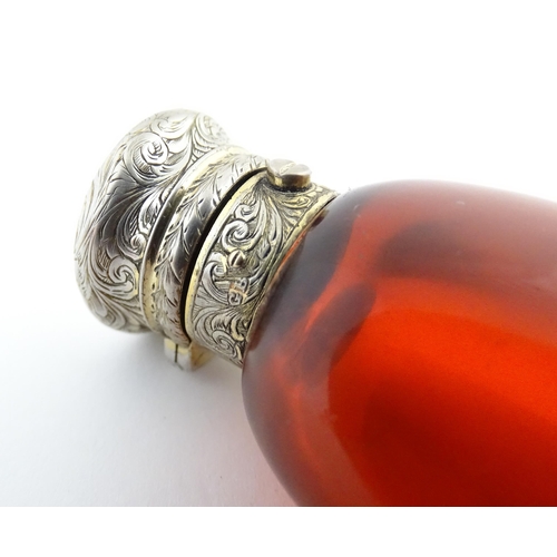 208 - A 19thC cranberry glass scent bottle / perfume flask with white metal top, maker GB. Approx. 3 1/2