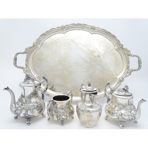 672 - A quantity of assorted silver plate items comprising an exceptionally large twin handled tray, a tea... 