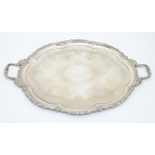 672 - A quantity of assorted silver plate items comprising an exceptionally large twin handled tray, a tea... 