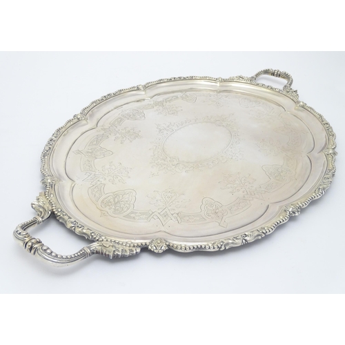 672 - A quantity of assorted silver plate items comprising an exceptionally large twin handled tray, a tea... 