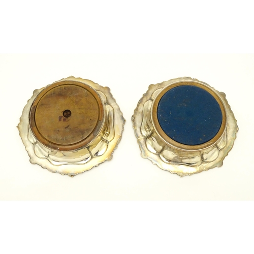 680 - A pair of 19thC silver plate bottle coasters with turned wooden bases. Together with a pair of silve... 