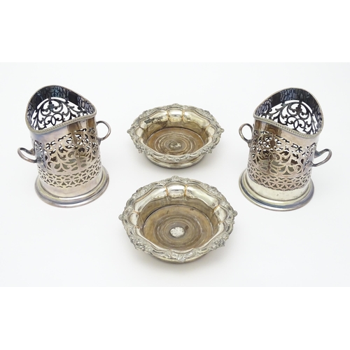 680 - A pair of 19thC silver plate bottle coasters with turned wooden bases. Together with a pair of silve... 