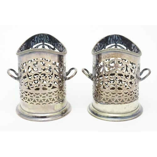 680 - A pair of 19thC silver plate bottle coasters with turned wooden bases. Together with a pair of silve... 