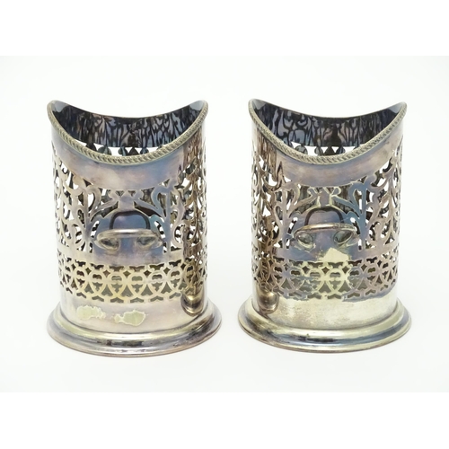 680 - A pair of 19thC silver plate bottle coasters with turned wooden bases. Together with a pair of silve... 